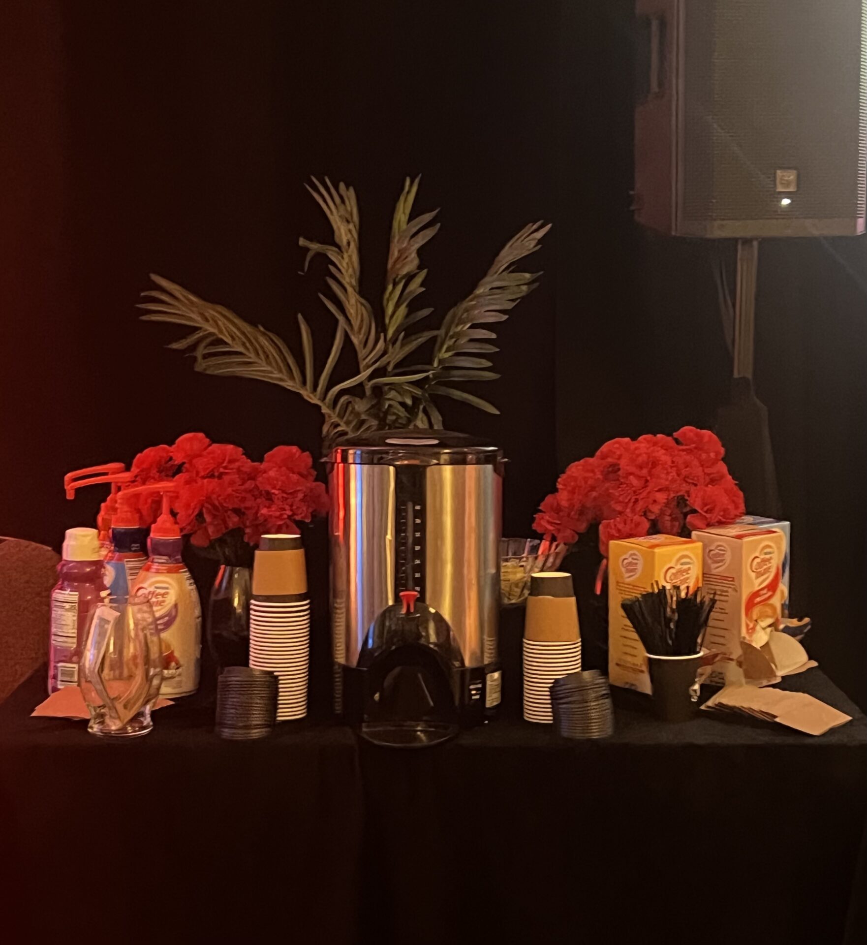 coffee with whipped cream and side cinnamon